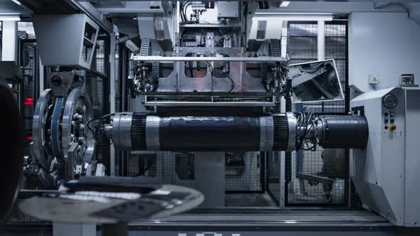 Robotic Tyre Plant Worker Operating Production Process in Factory Close Up alt