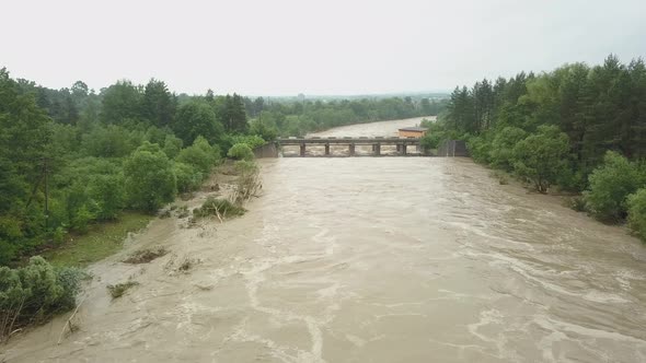 Aerial View of the Bridge During Floods. Extremely High Water Level in the River. Natural Disaster