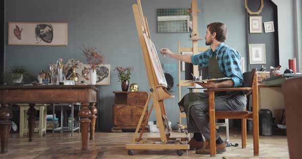 Male Artist Working in Studio