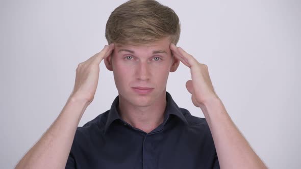 Young Stressed Blonde Businessman Having Headache alt