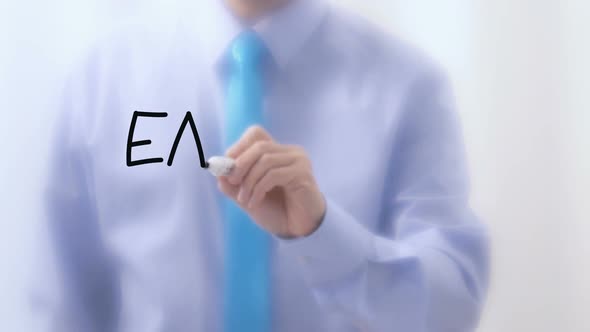 Earnings Written on Glass. Businessman Hand Writing Words with Marker Pen