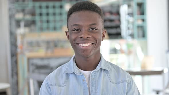 Cheerful African Man Smiling At Camera alt