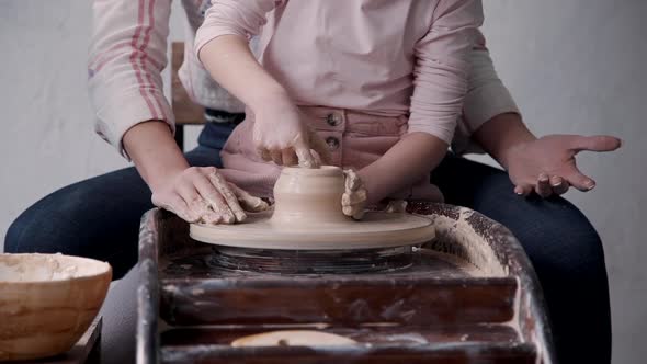 Two Ceramist Person Working with Clay Making Earthenware in Stud