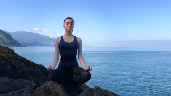 Girl Meditating at the Sea