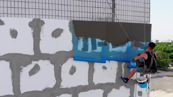 Aerial, Industrial Climber for Insulated Facades Putty Cement on Fiberglass Mesh alt