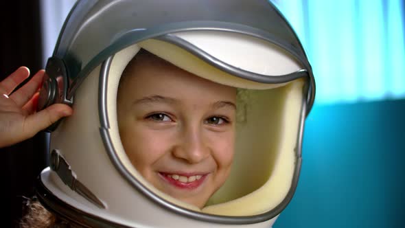 Child Plays at Home in an Astronautportrait Funny of a Little Girl 89 Years Old in a Toy Space alt