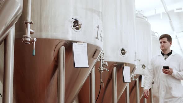 A Technologist at a Brewery Checks the Readiness of the Wort