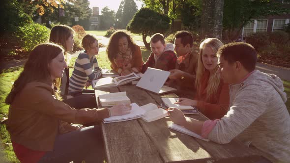 Group of college students on campus meeting outdoors