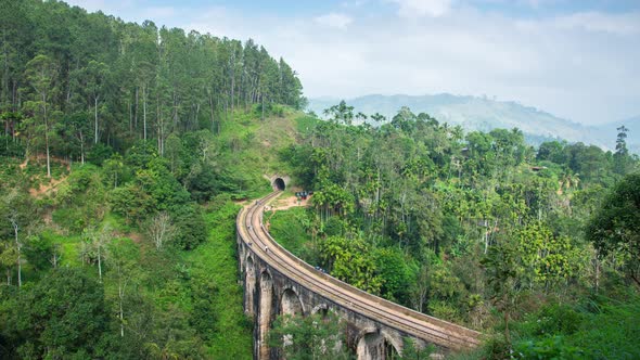 Time lapse 4k. Nine Arches Bridge, seen through the jungle, gardens and farms alt