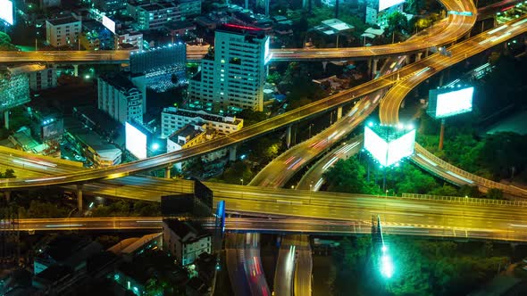 a top view of the city's car interchange at night. the movement of cars on the roads, light lines fr alt