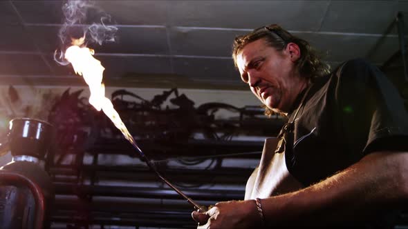 Welder burning welding torch alt