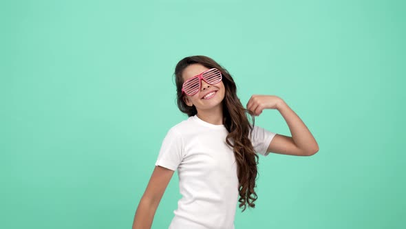 Happy Teen Girl in Glamour Glasses Having Party Fun and Dancing Fun