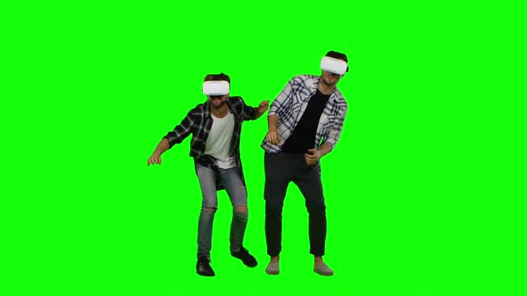 Young Mans Wearing Virtual Reality VR Glasses. Green Screen alt