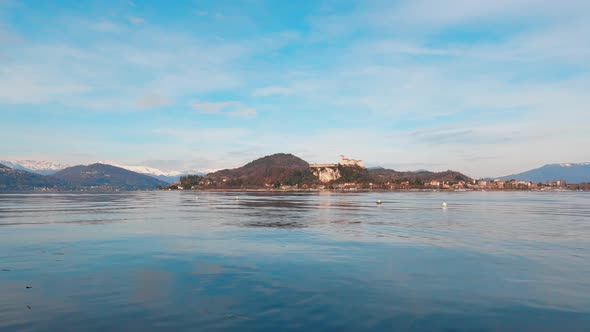 Maggiore Lake with Angera Castle in background. Low angle and static shot alt