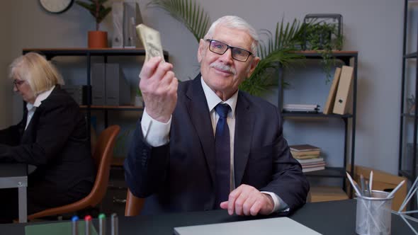 Senior Businessman Grandfather Company Director Receiving Money Cash Income From Laptop in Office alt