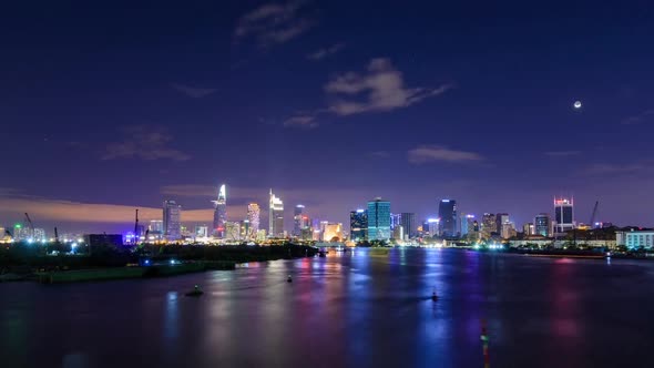 Cinemagraph of a timelapse of Saigon Skyline at night. Only the bottom part of the frame with sea an alt