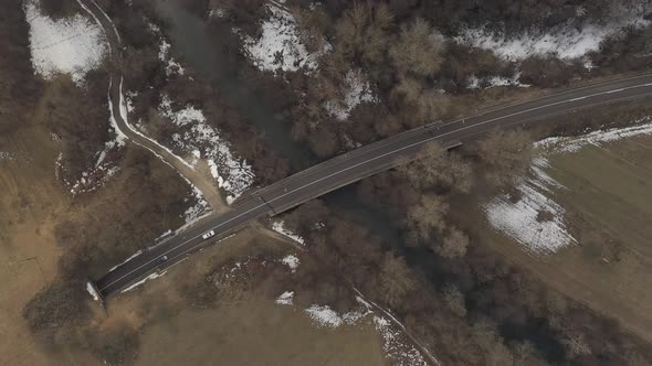 Vehicles passing over the bridge 4K aerial video