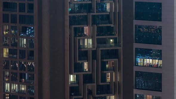 Windows in Highrise Building Exterior in the Late Evening with Interior Lights on Timelapse alt