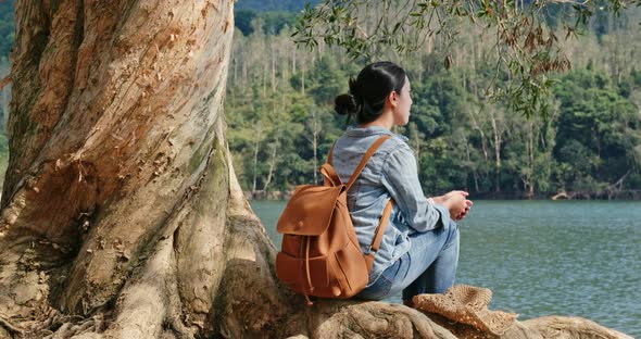 Woman enjoy view of the lake alt
