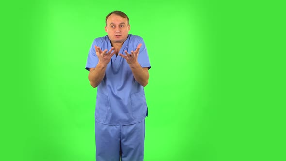 Displeased Man Indignantly Talking To Someone, Looking at the Camera. Green Screen alt
