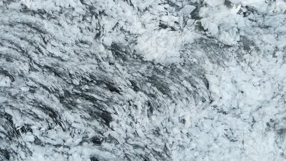 Aerial View of A Frozen River. Fancy Ice Texture, Cold Chained Water. Shards of Ice Stick out With alt