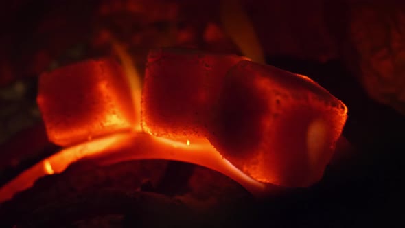 Hot Coals in the Hookah Bowl in Darkness Closeup in  in Slow Motion