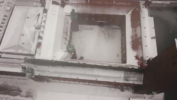 Smooth top down panning footage over the iconic town hall building in picturesque Stockholm. alt