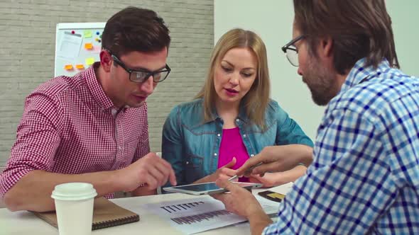 Executives Discussing Finances in Office alt