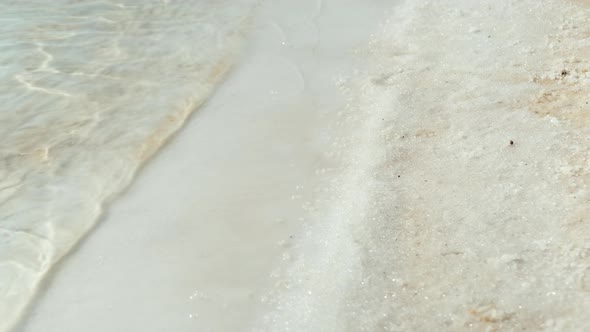 Female Feet Test the Warmth of the Water in the Dead Sea