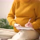 Pregnant Woman Takes Notes in a Notebook Makes a List of Necessary Things for Pregnancy Childbirth - VideoHive Item for Sale