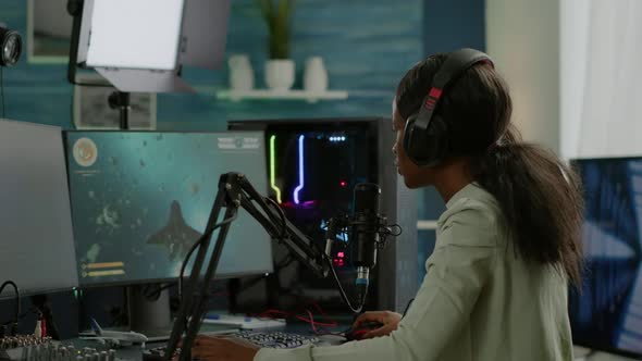 Professional e Sports Afro Gamer Talking on Microhone alt