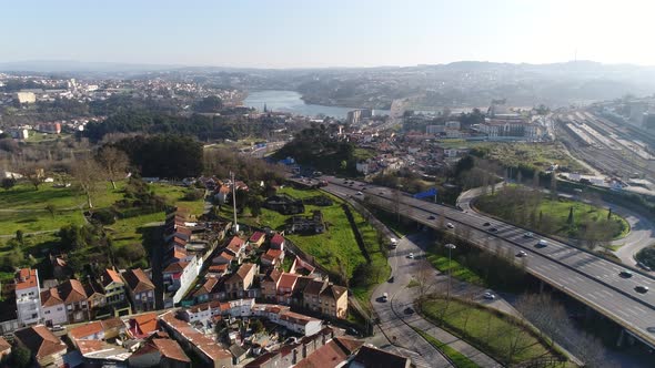 Aerial View of Busy Bypass and Ring Road at City Entrance. Cars and Buses Going Into Traffic alt