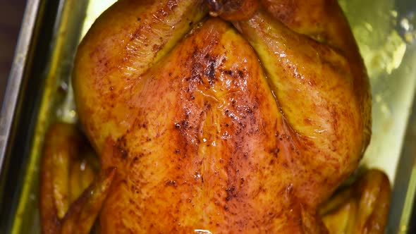 Homemade Roasted Chicken on Rotating Background, Slow-motion Shooting. Family Dinner