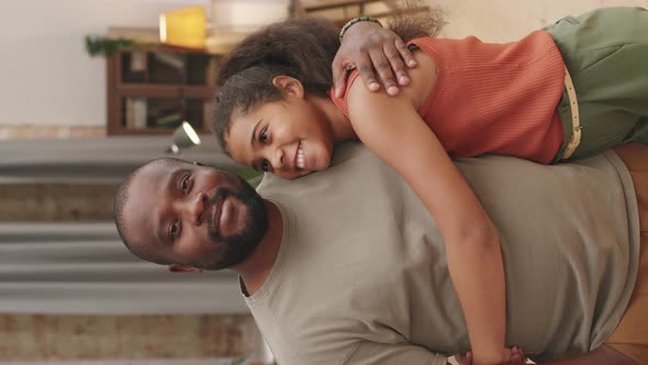 Portrait Of 10-Year-Old Afro Girl With Dad alt
