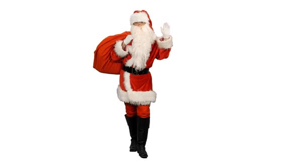 Santa Carrying Gifts in Sack and Waving Greetings