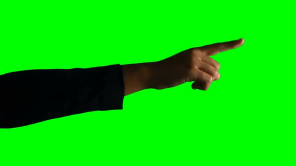 Person making hand gesture against green screen background alt