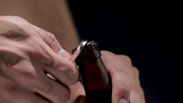 Opening Cold Bottle of Beer with Bottle Opener