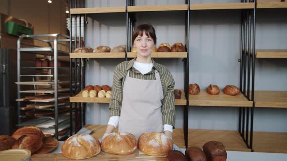Portrait of Beautiful Caucasian Woman at Work in Bakery alt