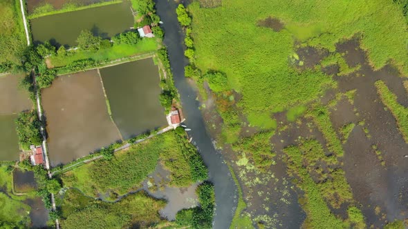Aerial: North Vietnam karst landscape at sunset, drone view of Ninh Binh canyons and pinnacles alt