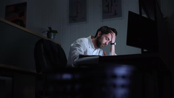 Portrait of Young Executive Manager in White Shirt Feeling Bored and Overworked While Doing alt