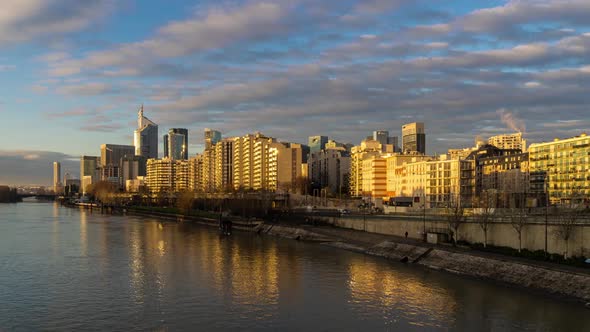 Sunrise with Clouds on La Defense Business District, Paris, Seine River, Traffic and Buildings alt