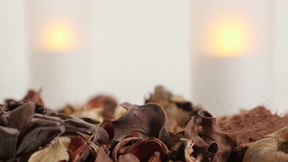 Dry fragrant petals and spices of potpourri mixture 4K 2160p 30fps UltraHD footage - Relaxing  light alt