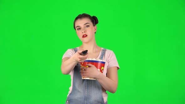 Gir Chews Popcorn and Changing Channels with TV Remote. Green Screen alt