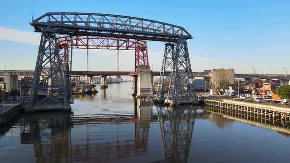 Aerial pan of famous bridge Puente Transbordador in Buenos Aires alt