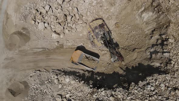 Trucks Load Limestone Into A Machine For Transportation alt