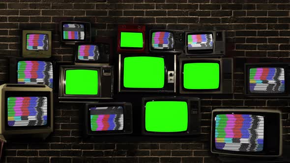 Five Old TVs Green Screen Against Brick Wall. 4K.