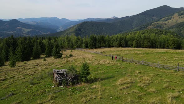 Two persons have a hike in the mountains