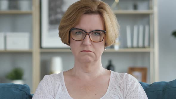 Portrait of Sad Old Senior Woman Looking at Camera alt