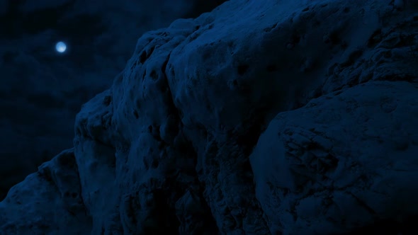 Moving Under Weathered Old Rocks In Moonlight alt