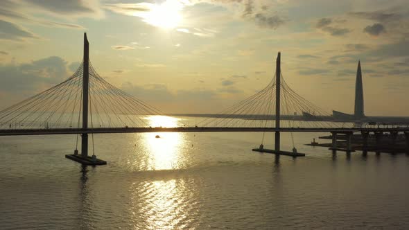 Cable-stayed Bridge and New Skyscraper at Sunset alt